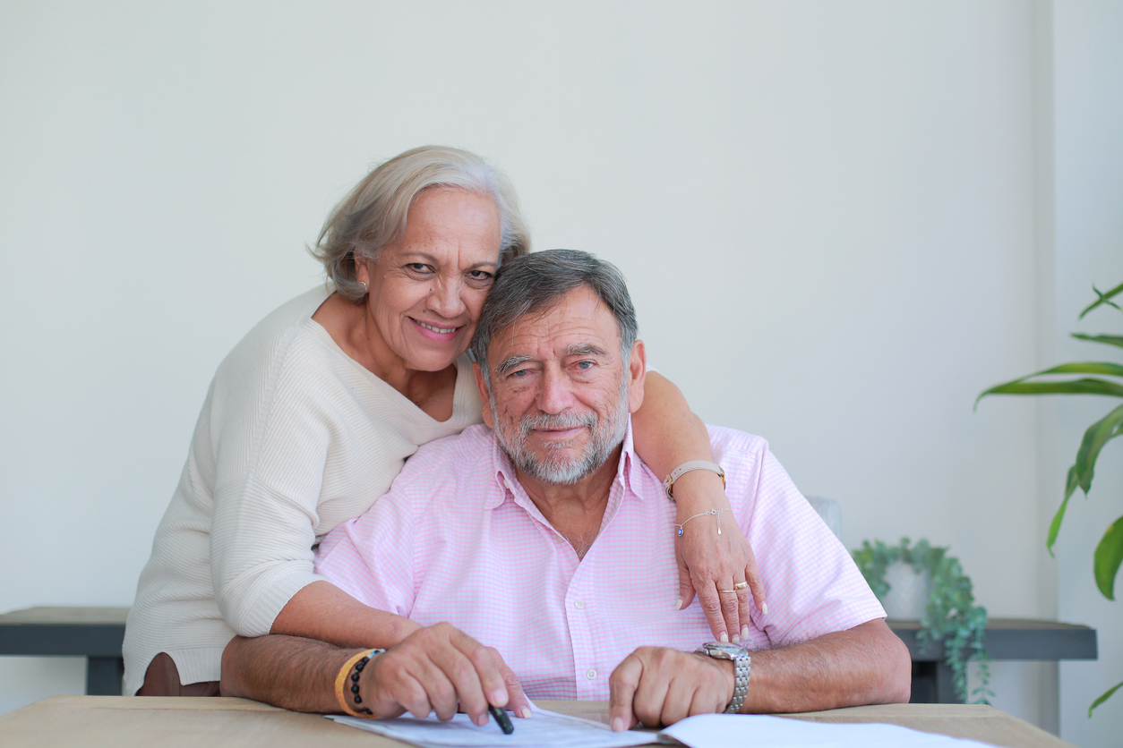 Caregiver and senior smiling