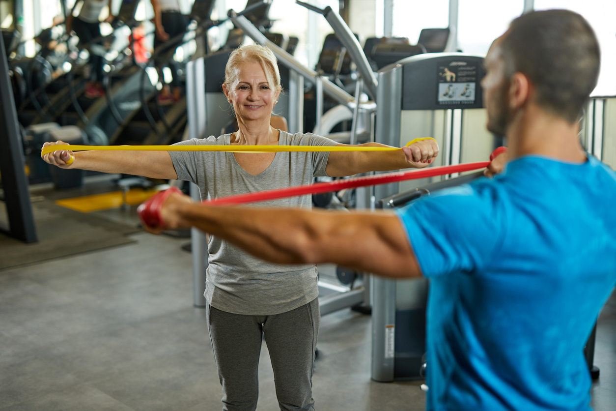 Caregiver helping patient with exercises
